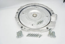 Load image into Gallery viewer, Front view of LS to Jaguar 8HP adapter plate with integrated dust shield and billet flex plate